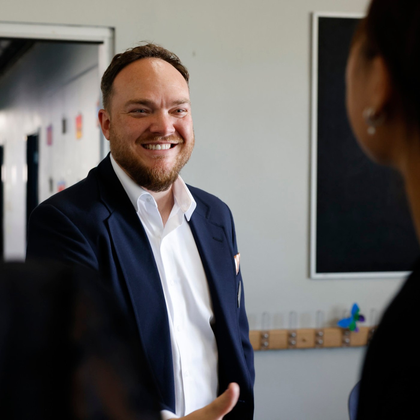 David Blair, executive director, in conversation with partners at a school.